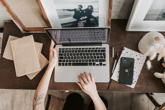 image of woman typing on laptop