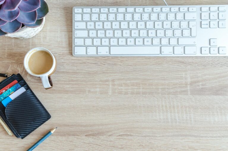 White Apple Keyboard Near White Cup - How do niche sites make money